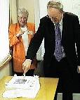 Sir Sydney Chapman MP, cuts the official cake